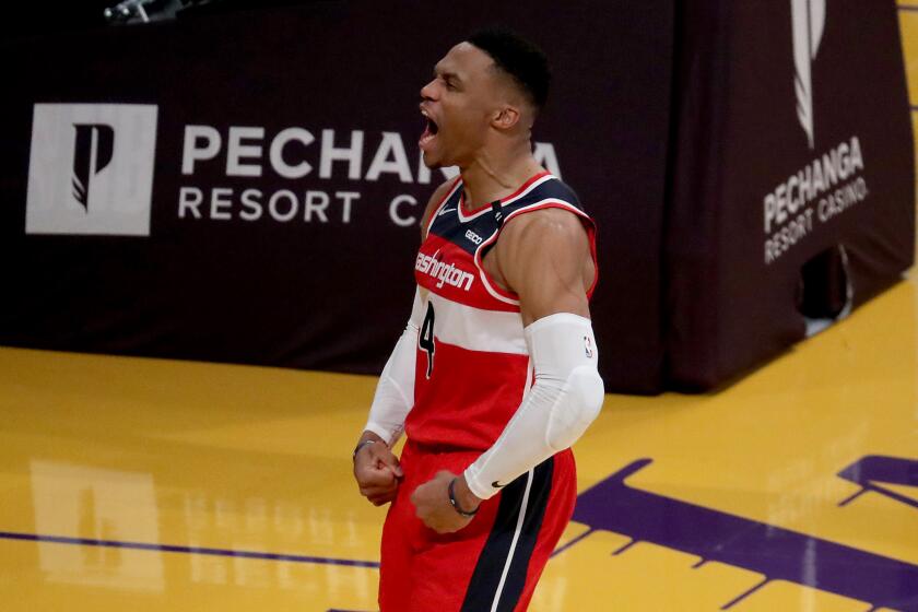 Wizards guard Russell Westbrook celebrates after scoring a basket and getting fouled against the Lakers on Feb. 23, 2021.