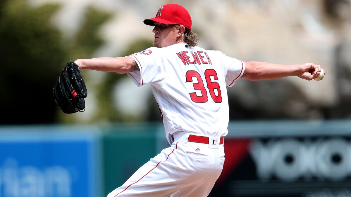 Angels starter Jered Weaver gave up six hits and one run -- on a homer -- in six innings against the Rangers on Sunday.