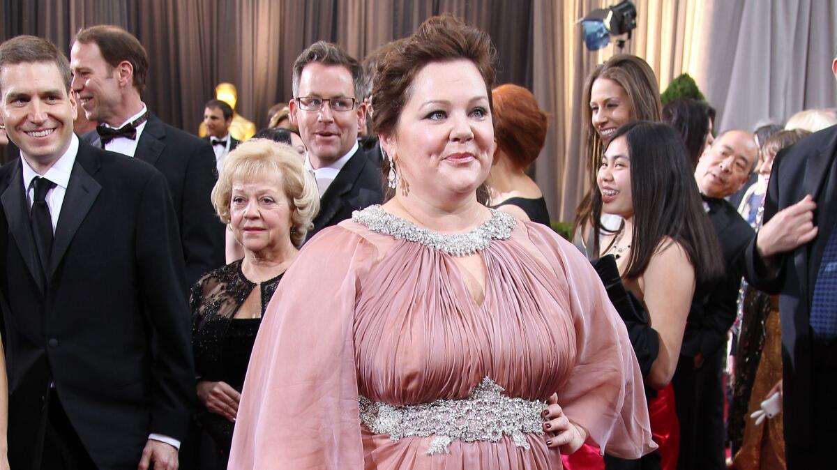 Melissa McCarthy poses on the red carpet at the 2012 Academy Awards. At the time, McCarthy said she was turned down by high-level fashion designers.