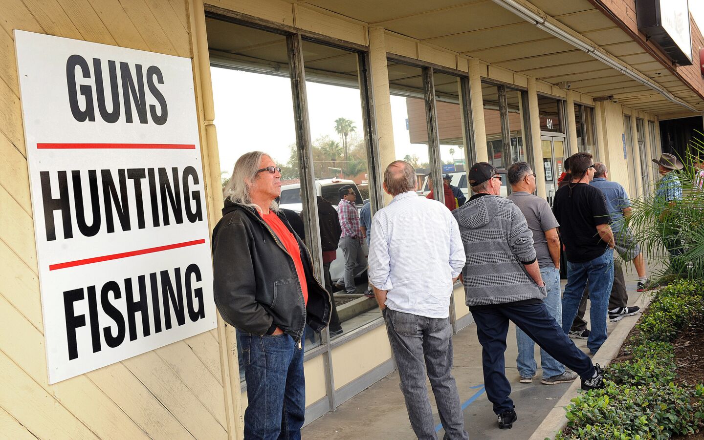 Customers wait for the doors to open at Turner's Outdoorsman in San Bernardino Wednesday morning.