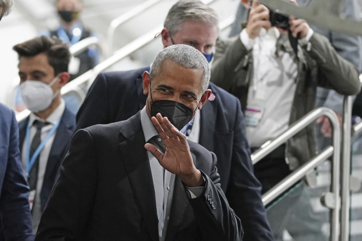 Former President Obama waving