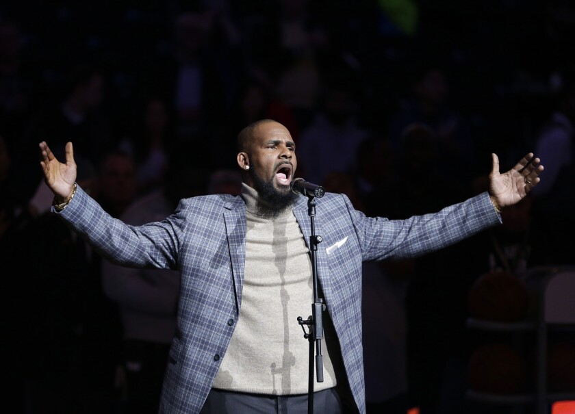 R. Kelly performs the national anthem before an NBA game in 2015.