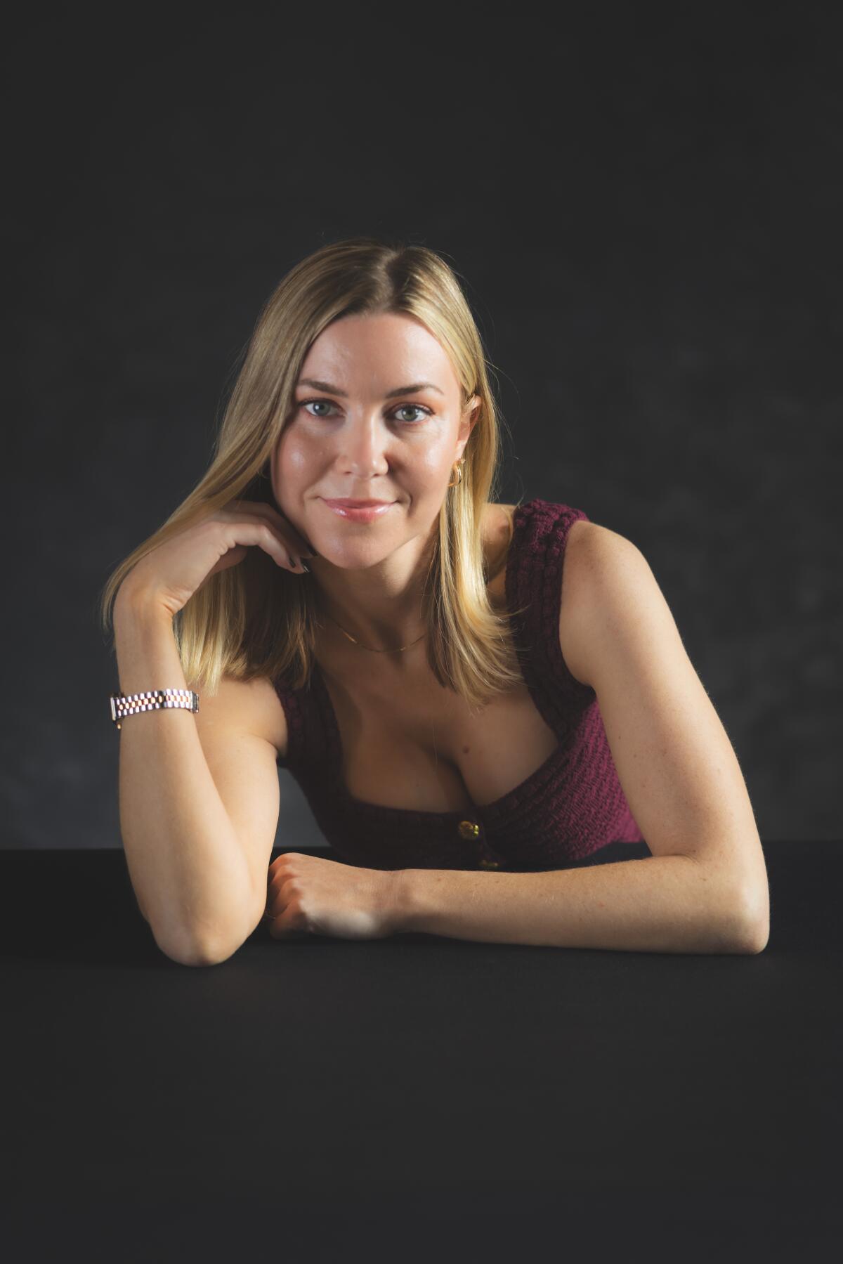 Kelsey Cook leans forward