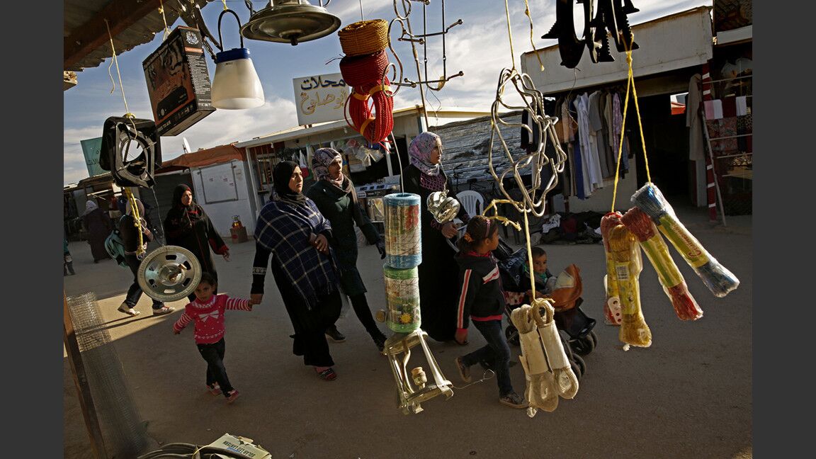 In Zaatari there are vegetable stands and cellphone kiosks, bicycle repair outlets and bakeries, restaurants, barber shops, beauty salons and wedding boutiques. Some shops feature caged songbirds outside, a common fixture in Syria.