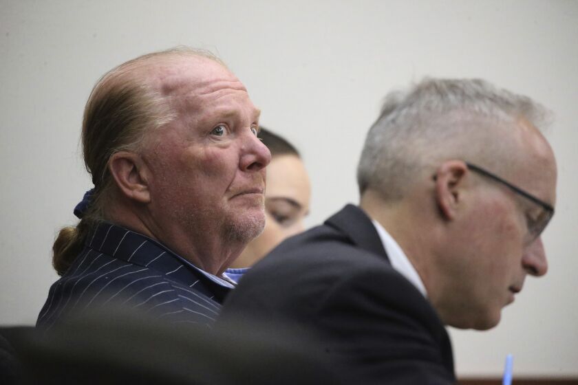 Celebrity chef Mario Batali is seated at Boston Municipal Court on the second day of his sexual misconduct trial on Tuesday, May 10, 2022 in Boston. Batali pleaded not-guilty to a charge of indecent assault and battery in 2019, stemming from accusations that he forcibly kissed and groped a woman after taking a selfie with her at a Boston restaurant in 2017. (Stuart Cahill/The Boston Herald via AP, Pool)