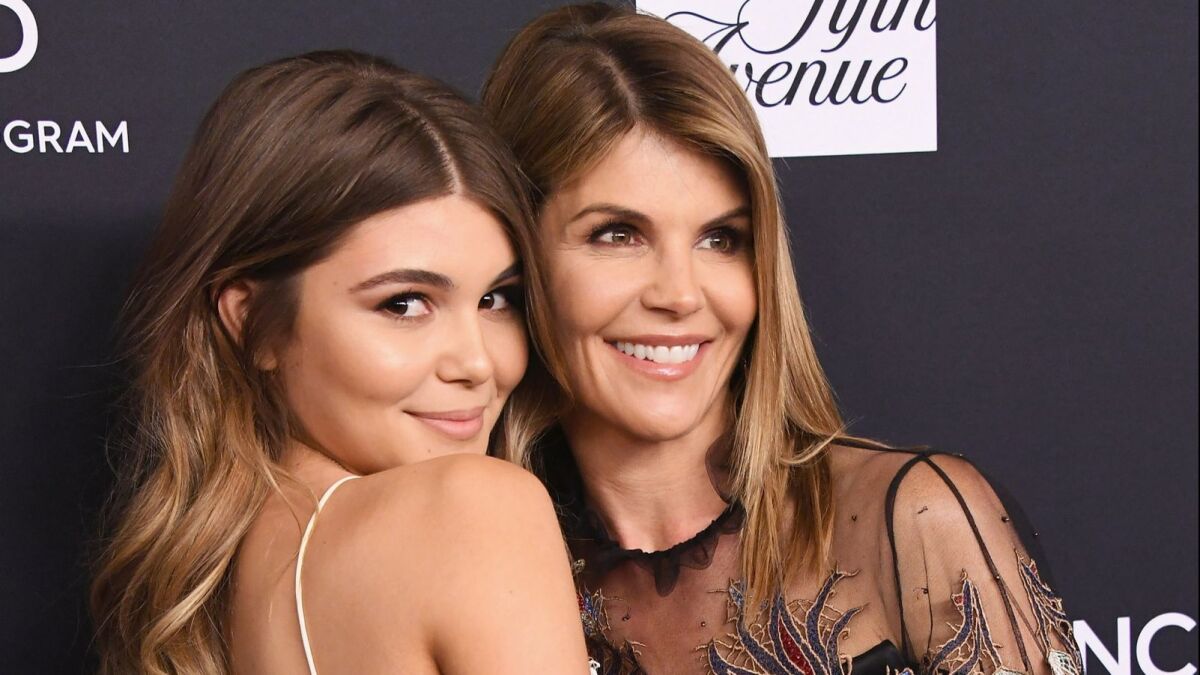 Olivia Jade Giannulli and mother Lori Loughlin attend a benefit gala in Beverly Hills in 2018.