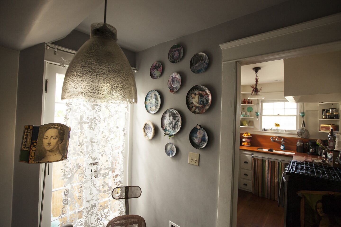 A plate collection graces the dining room wall.