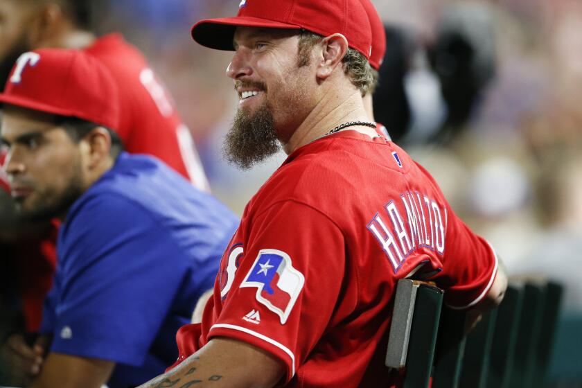 Rangers outfielder Josh Hamilton watches from the bench during the fifth inning of a game against the Orioles on Apr. 16.