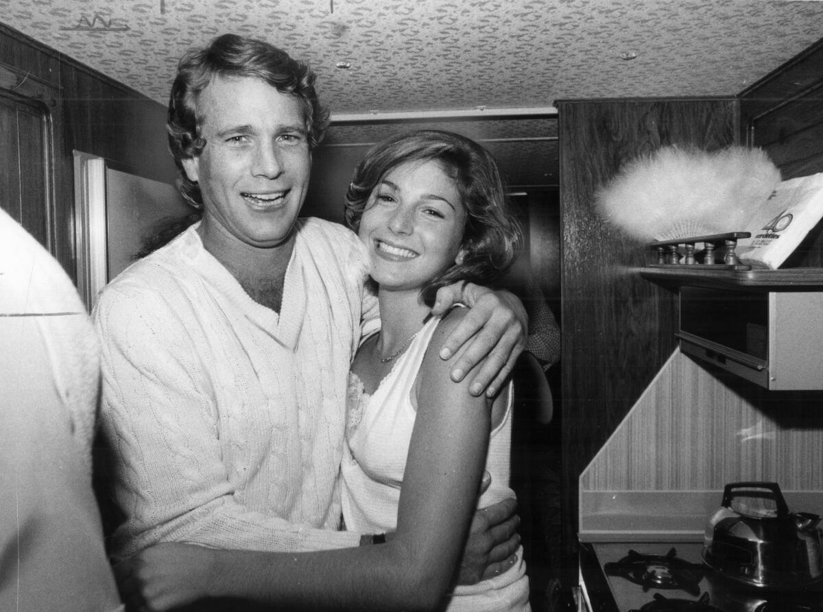 Tatum and Ryan O'Neal photographed in 1980 on the set of the film "Circle of Two."