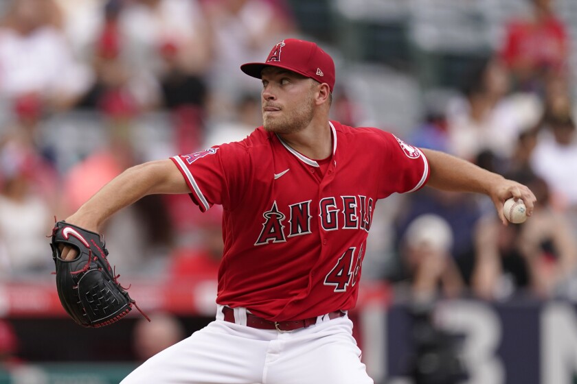 Angels starting pitcher Reid Detmers delivers during the second inning of a 5-2 loss to the Texas Rangers on Sunday.