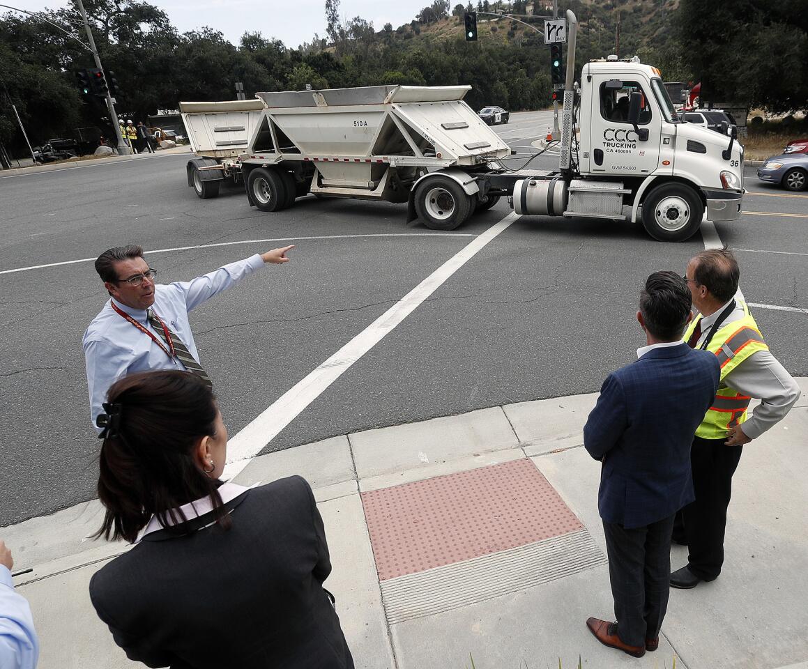 Photo Gallery: La Canada city and school officials observe debris truck traffic from Devil's Gate Dam cleanup