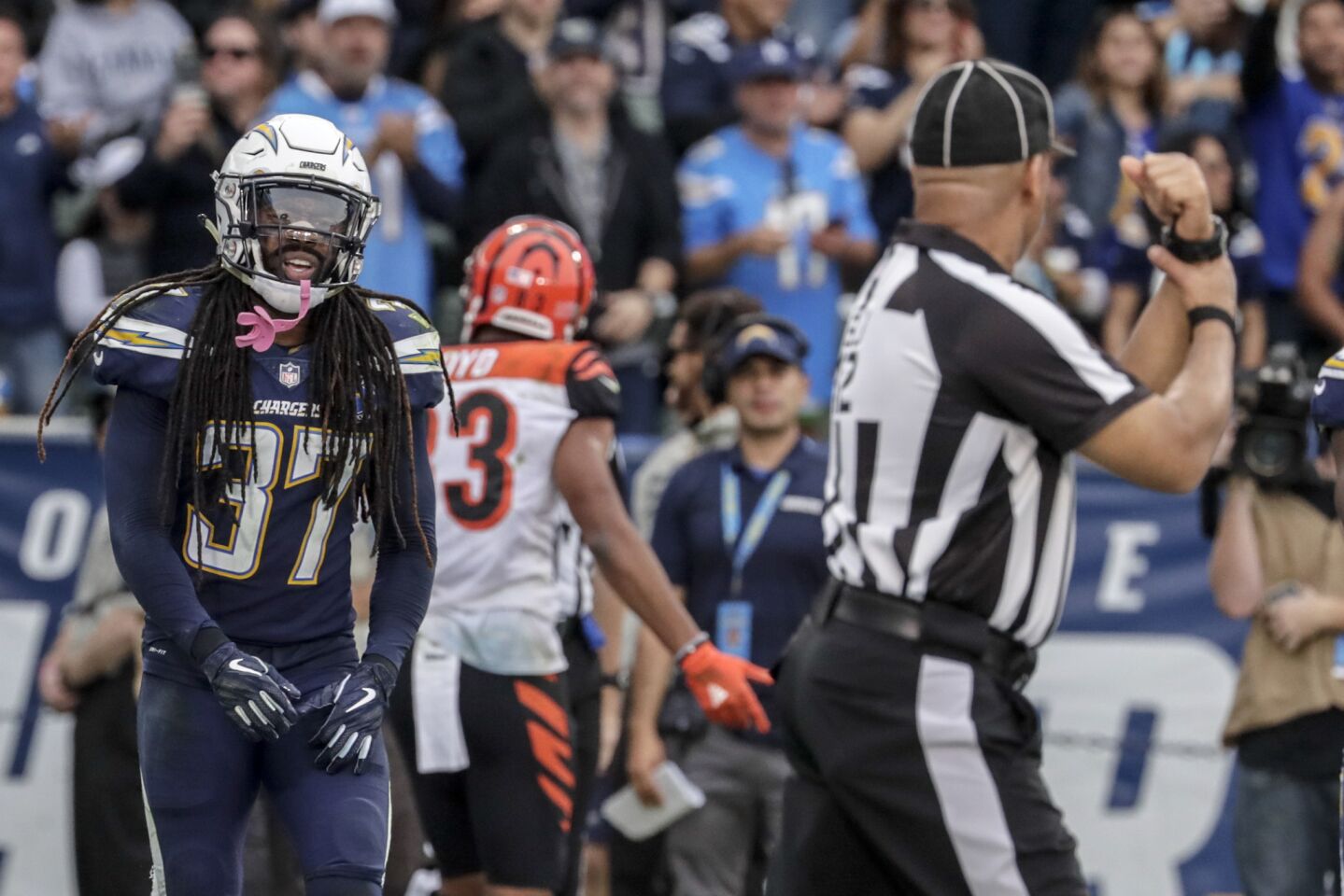 Chargers saefety Jahleel Addae shows his frustration with an official after he is called for holding tight end CJ Uzomah in the end zone.