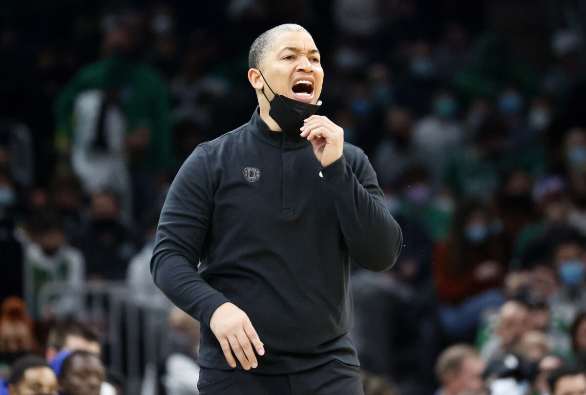 Clippers coach Tyronn Lue yells instructions to his team from the sideline.