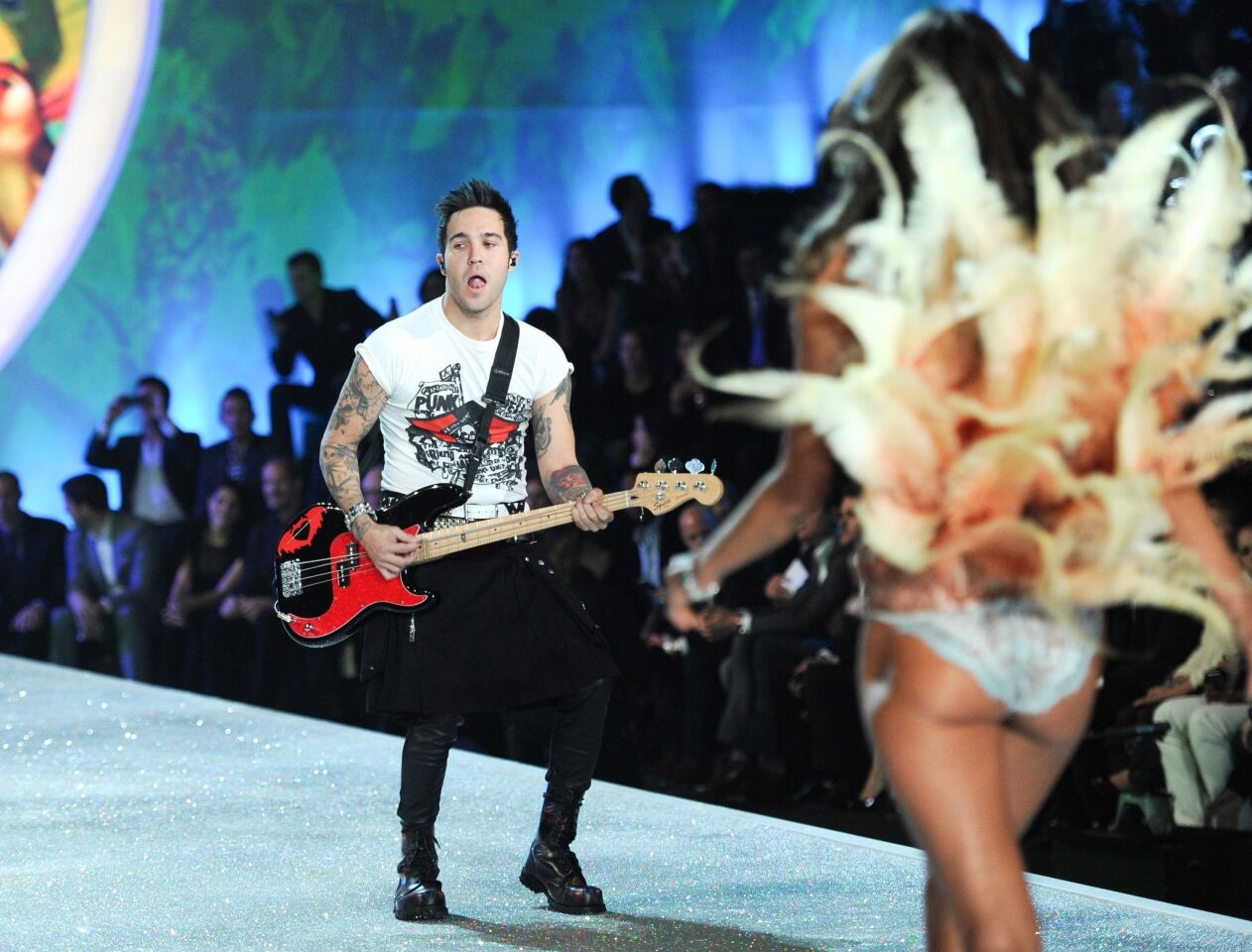 Musician Pete Wentz of Fall Out Boy performs as a model walks the runway at the 2013 Victoria's Secret Fashion Show on Wednesday in New York.