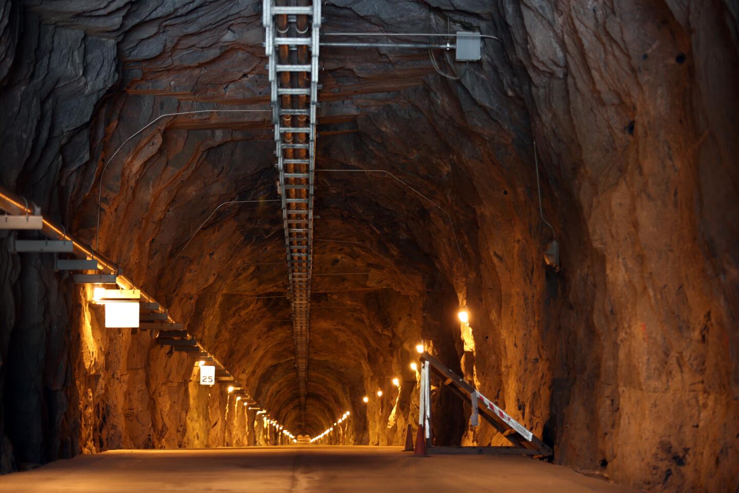 BIG CREEK, CA - JULY 28, 2015: The long cave tunnel that leads to a generator turbine that spins 200 feet beneath Shaver Lake at Southern California Edison's Big Creek John S. Eastwood Power Station which has produced cheap and reliable electricity for decades but now the drought may sideline the station on JULY 28, 2015.