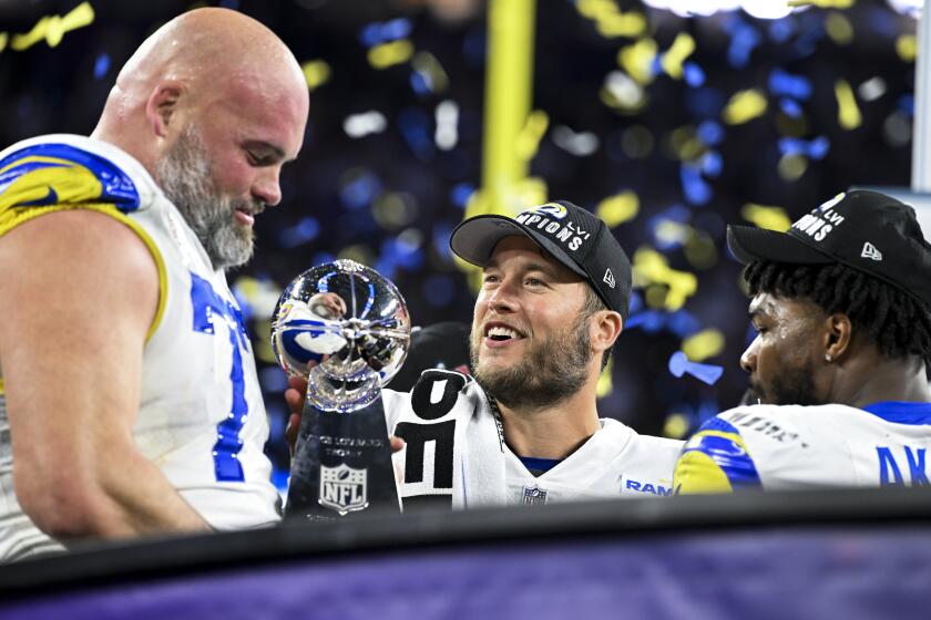 Rams offensive Andrew Whitworth celebrates with Matthew Stafford and Cam Akers 