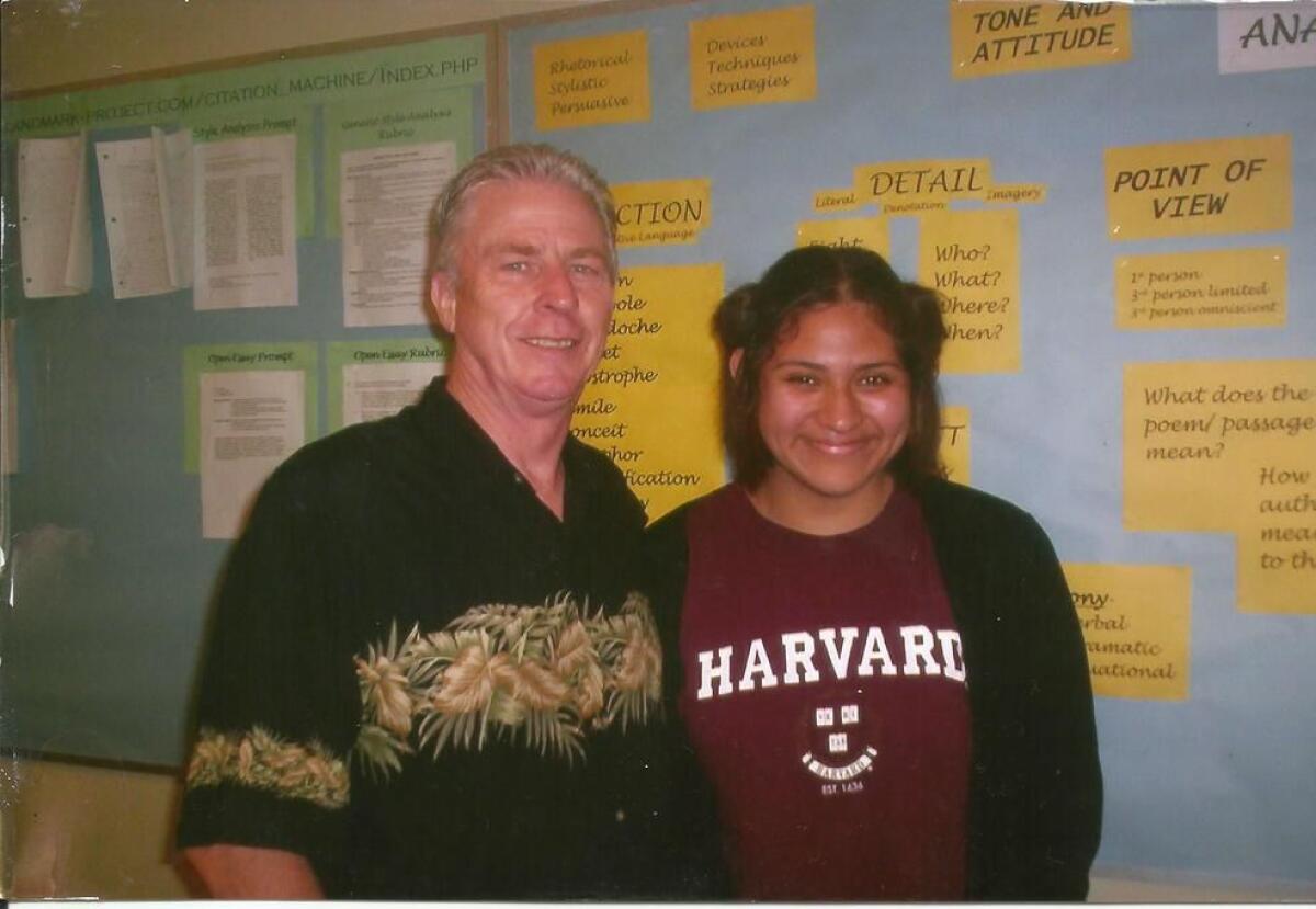 Santa Ana High School English teacher Bill Roberts poses for a photograph with student Gloria Montiel in 2005.