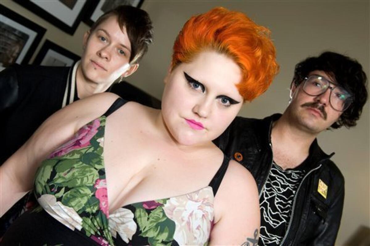 FILE - In this Oct. 9, 2009 file photo,"Gossip" band members, from left, Hannah Blilie, Beth Ditto and Brace Paine pose for portrait in New York. (AP Photo/Charles Sykes, file)