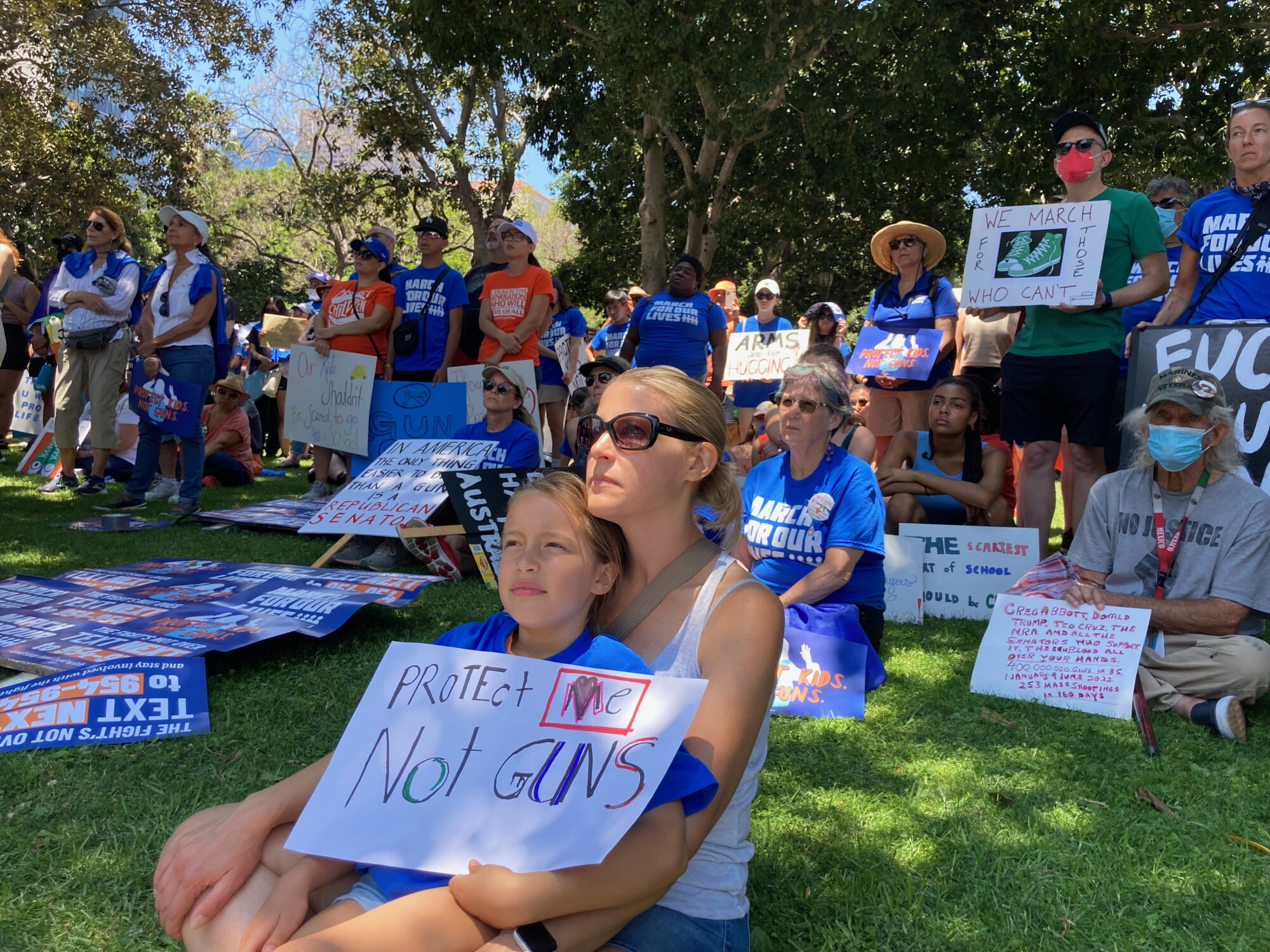 Mother and daughter listen to speakers