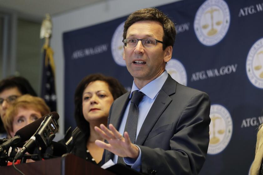 FILE - In this Aug. 26, 2019, file photo, Washington Attorney General Bob Ferguson speaks at a news conference in Seattle. Washington state sued Johnson & Johnson on Thursday, Jan. 2, 2020, claiming the company was negligent when it used deceptive marketing to say the drugs were effective for treating pain and were unlikely to cause addiction. The lawsuit filed Thursday says the company that supplies raw materials used to make opiates drove the pharmaceutical industry to recklessly expand the production of the drugs. (AP Photo/Ted S. Warren, File)