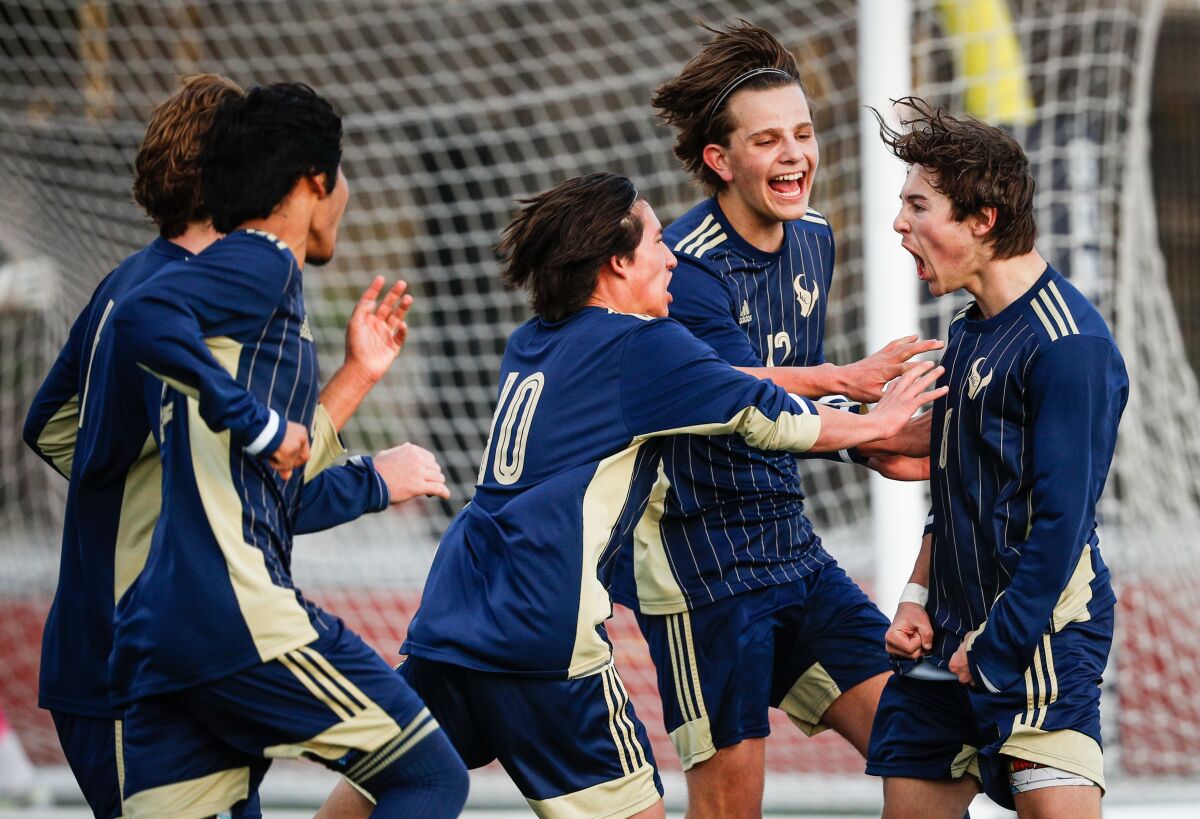 La Costa Canyon players celebrate the game’s only goal from Colin Yarbrough (right) against Steele Canyon on Friday.