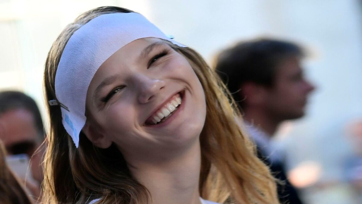 Model during fashion show in Milan. A smile should be natural, not perfect, one expert says.
