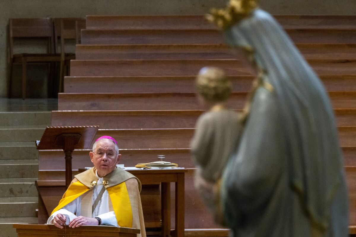 FILE - Archbishop Jose H. Gomez of the Archdiocese of Los Angeles, leads a live-steam service at an empty Cathedral of Our Lady of the Angels in Los Angeles on May 1, 2020. In the wake of the Supreme Court leak on abortion rights, a call for a day of fasting and prayer came from Gomez, the president of the U.S. bishops conference, and Archbishop William Lori of Baltimore, chairman of the USCCB’s Committee on Pro-Life Activities. They specifically requested prayers for the overturning of Roe and for “the conversion of the hearts and minds of those who advocate for abortion.” (AP Photo/Damian Dovarganes, Pool, File)