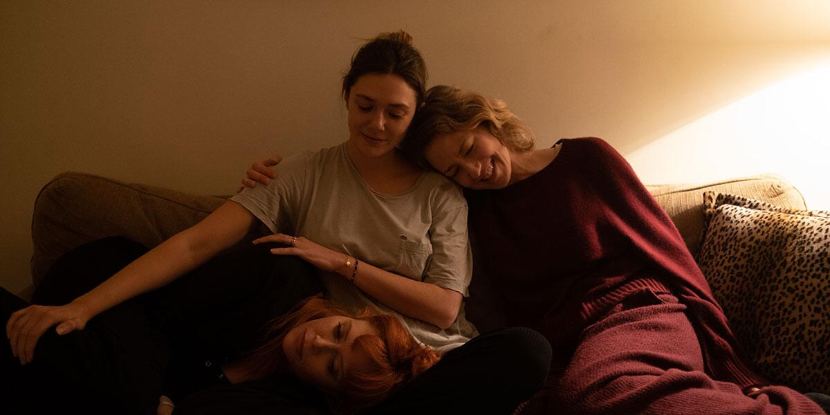 Three women on a couch