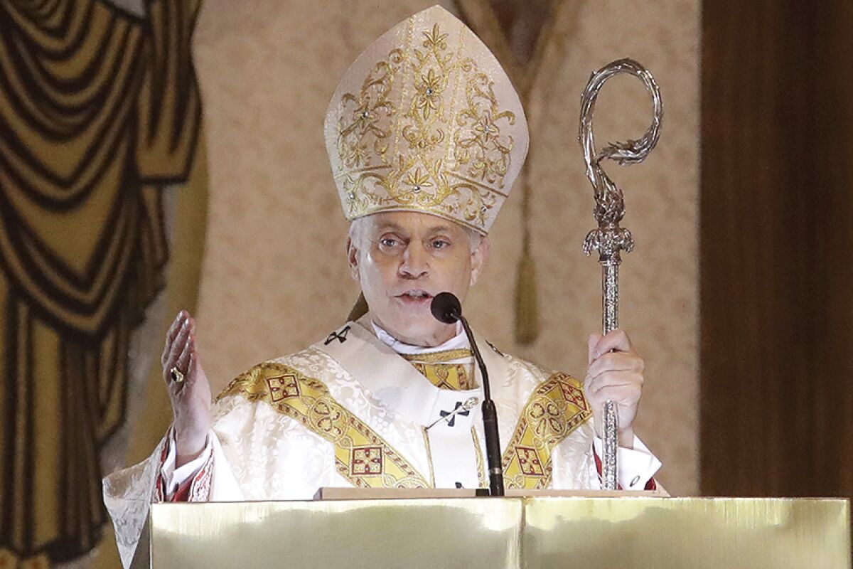 San Francisco Archbishop Salvatore Cordileone speaks at a microphone