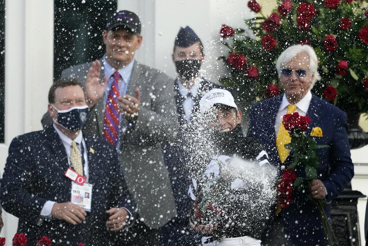 John Velazquez celebrates after riding Authentic to victory in the 146th running of the Kentucky Derby.