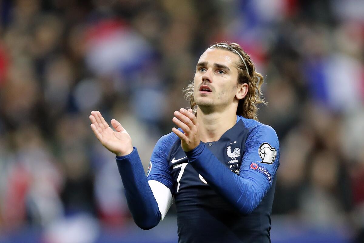 France's Antoine Griezmann applauds French supporters at the end of the Euro 2020 group H qualifying soccer match between France and Moldova at the Stade de France stadium, in Saint Denis, north of Paris, Thursday, Nov. 14, 2019. (AP Photo/Francois Mori)
