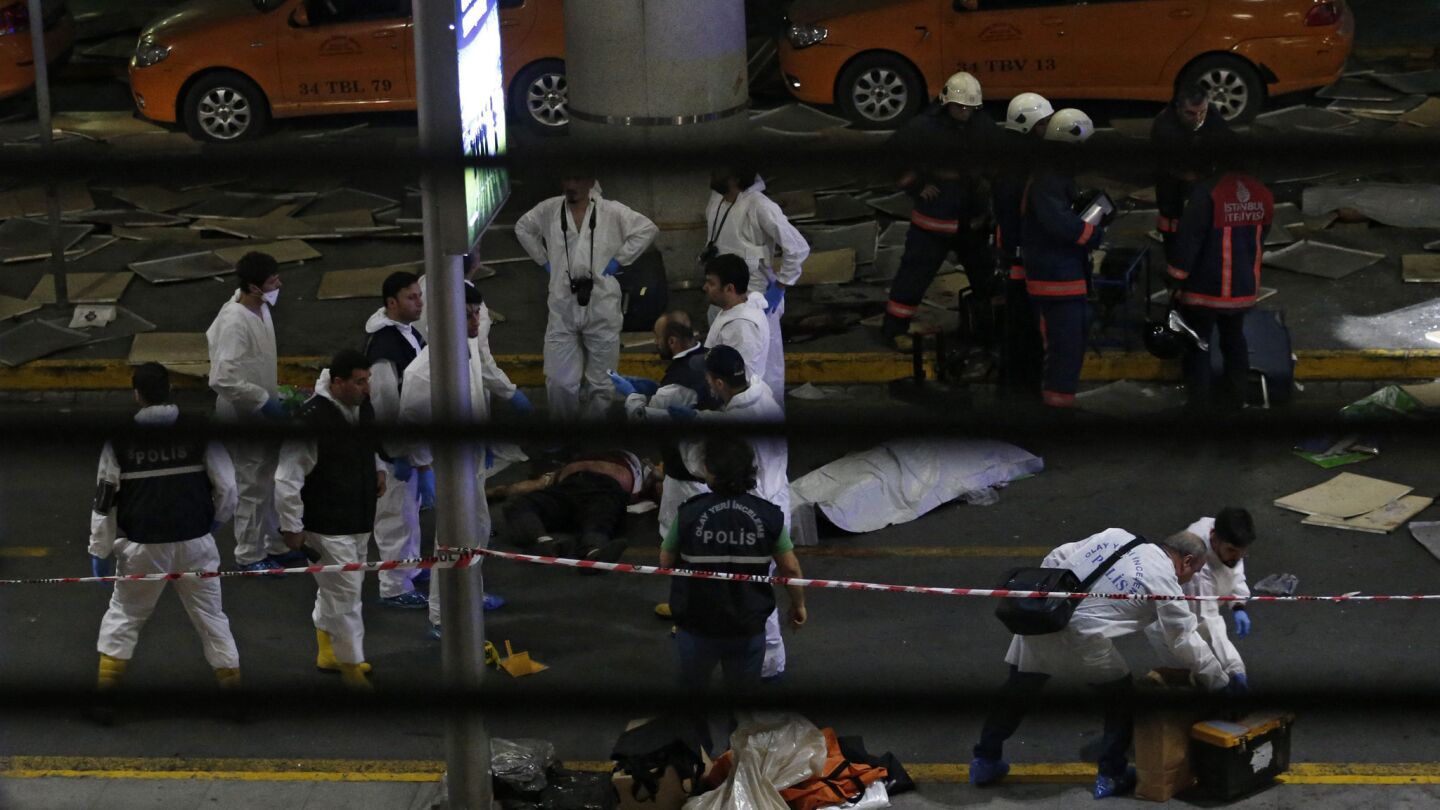 Crime scene investigators go to work after an attack at Ataturk Airport in Istanbul.