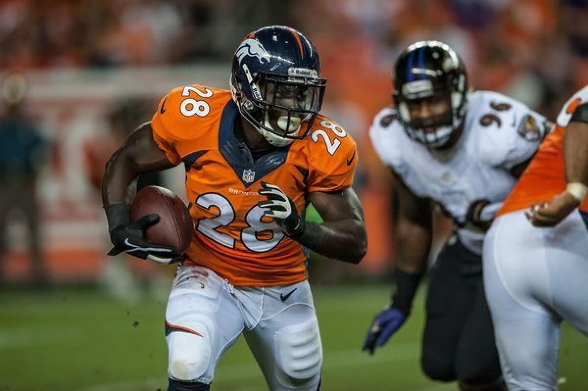 Running back Montee Ball, No. 28 of the Denver Broncos, rushes against the Baltimore Ravens.