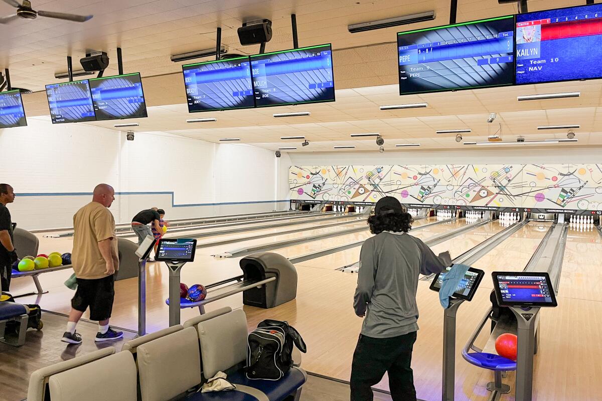 People show off their bowling skills.
