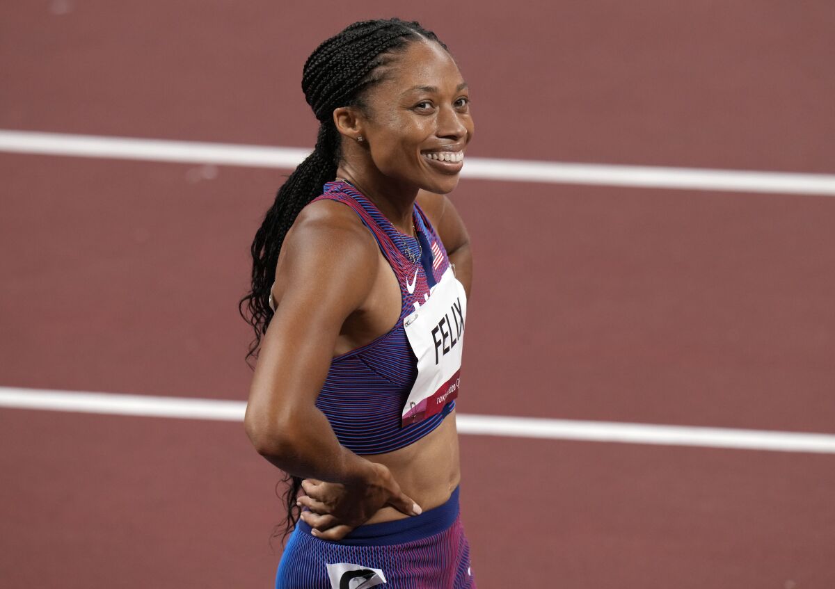 Allyson Felix smiles after taking bronze in the women's 400 meters at the Tokyo Olympics on Friday.