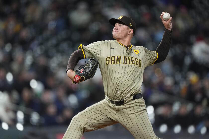 San Diego Padres pitcher Adrian Morejon (50) in the fifth inning of a baseball game Tuesday, April 23, 2024, in Denver. (AP Photo/David Zalubowski)