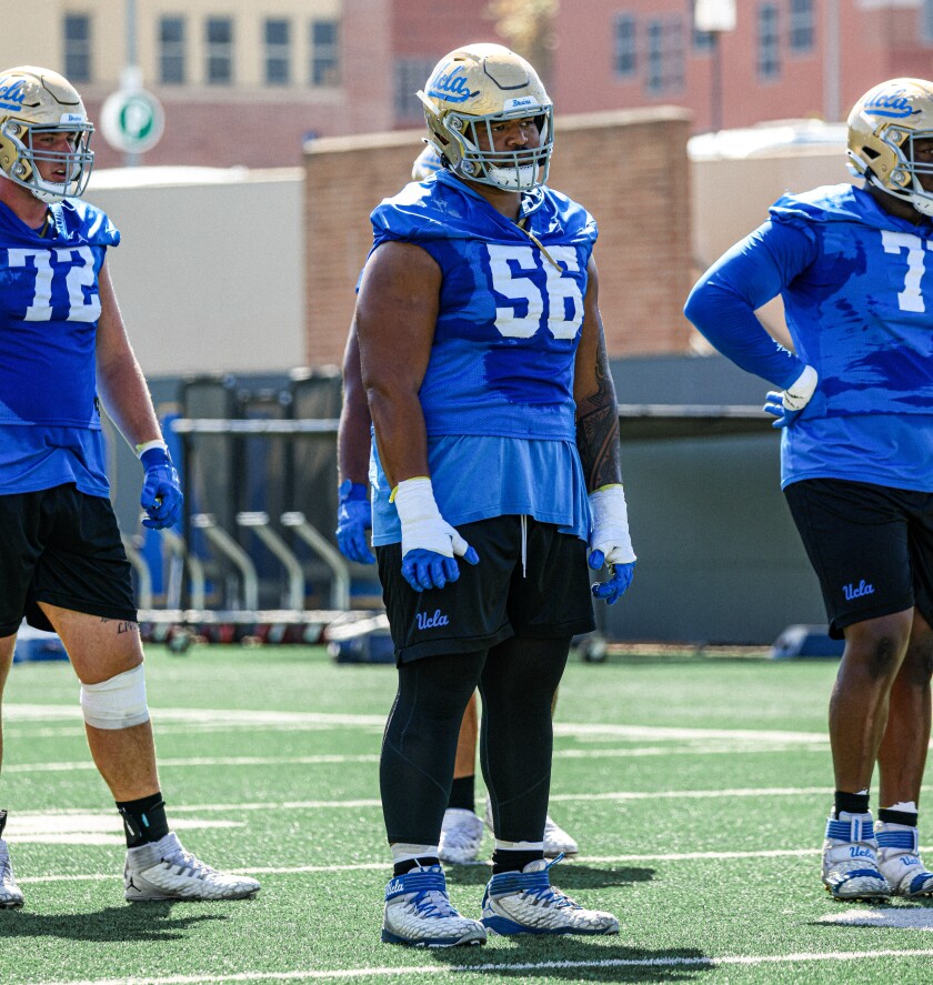 UCLA offensive lineman Atonio Mafi takes part in training camp drills.