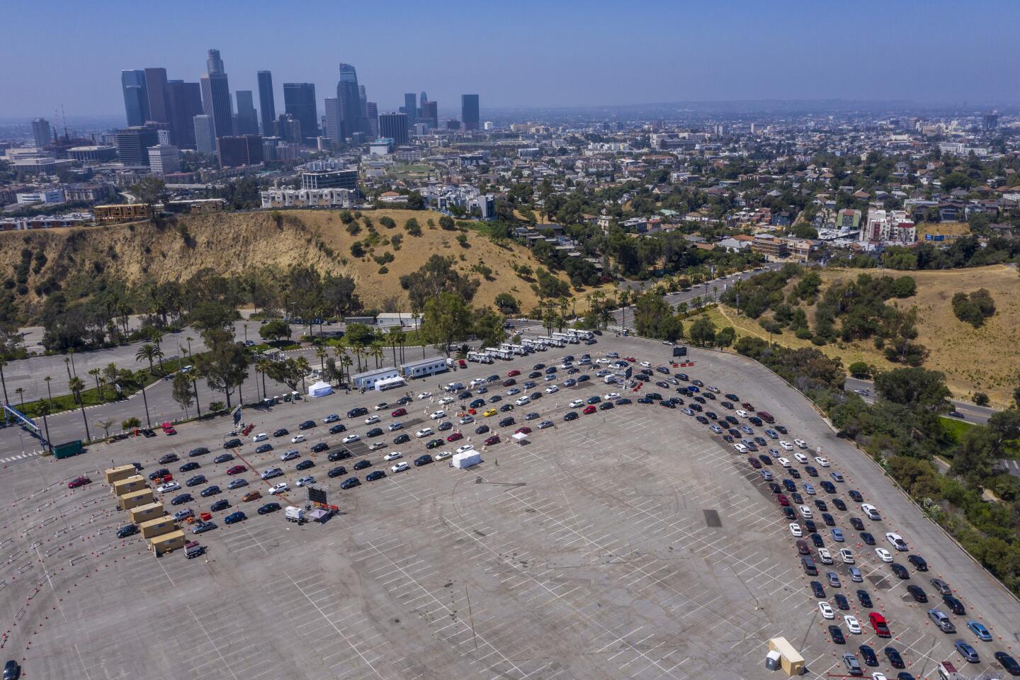 A drone image shows cars waiting for COVID testing at Dodger Stadium.