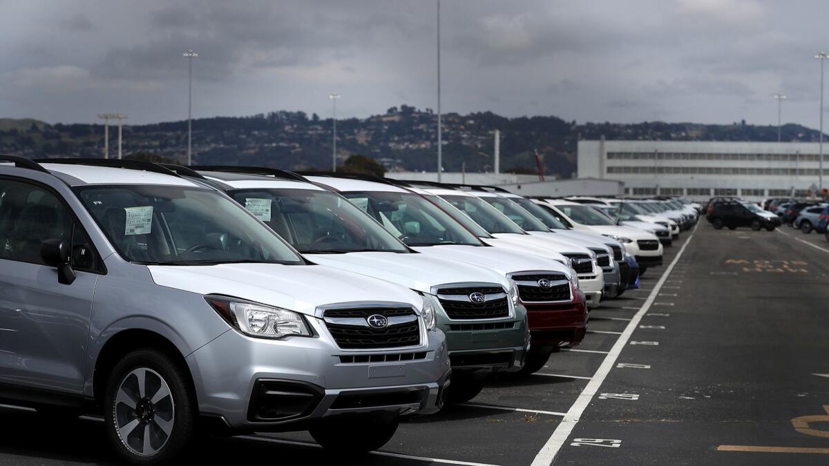 New cars sit in a lot at the Auto Warehousing Co. in Richmond, Calif., on May 24, 2018.