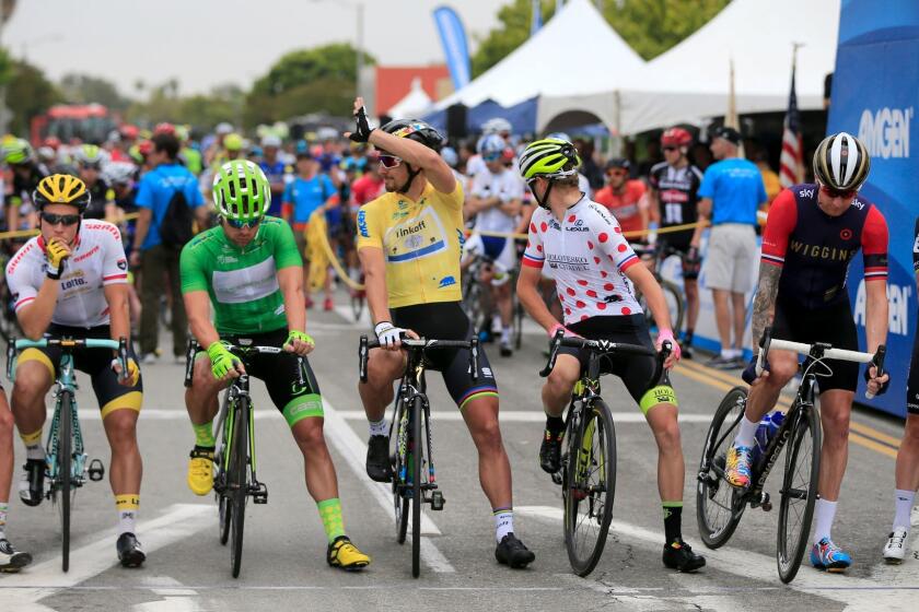 Peter Sagan, center, waves to fans at the start of Stage 2 of the 2015 Amgen Tour of California in Pasadena.