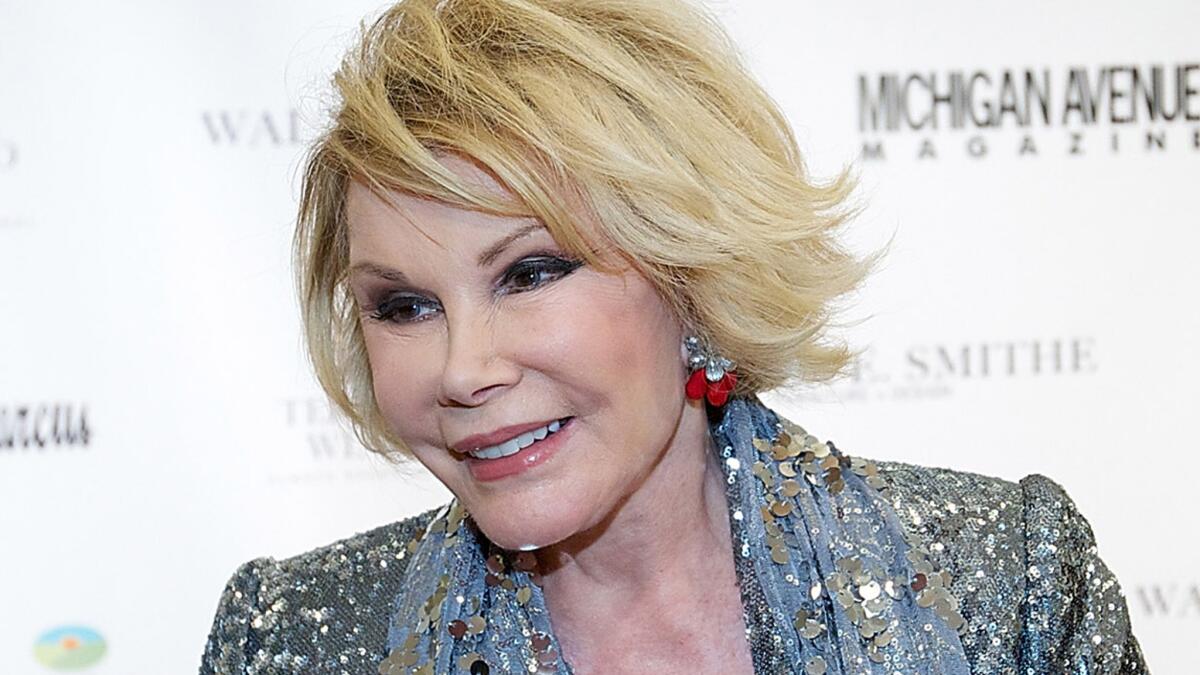 Joan Rivers' personal ear-nose-throat doctor may have taken a selfie in the operating room while the comic was sedated for an upper endoscopy, CNN reported Tuesday.