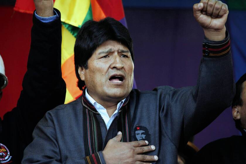 Bolivian President Evo Morales, singing the national anthem at a May Day march in La Paz, has expelled USAID from his nation, complaining that Washington "still has a mentality of domination and submission" in the region.