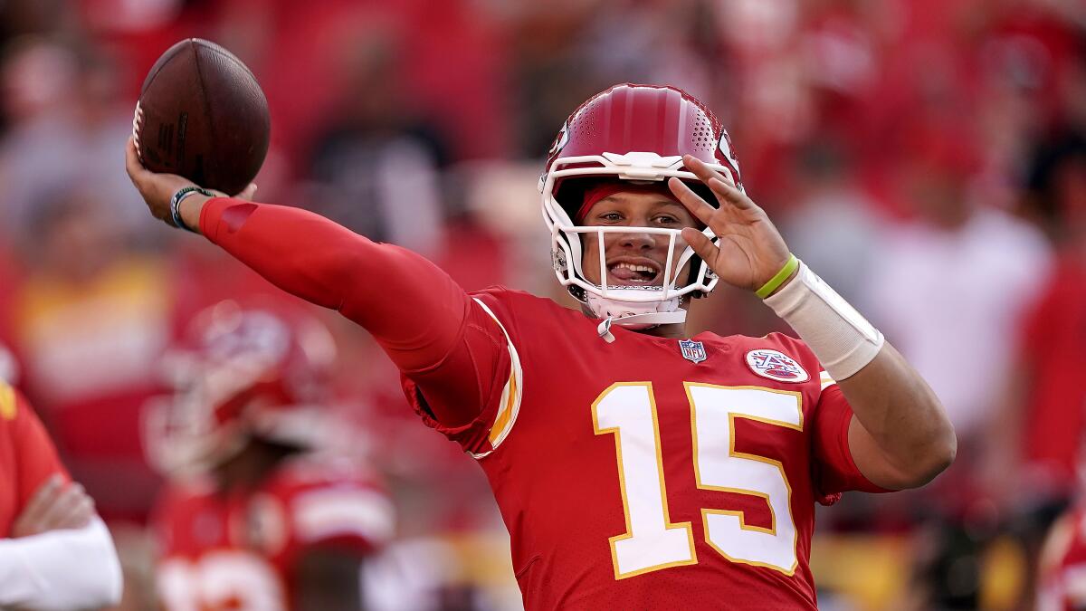 Kansas City Chiefs quarterback Patrick Mahomes throws during warmups before a preseason game.