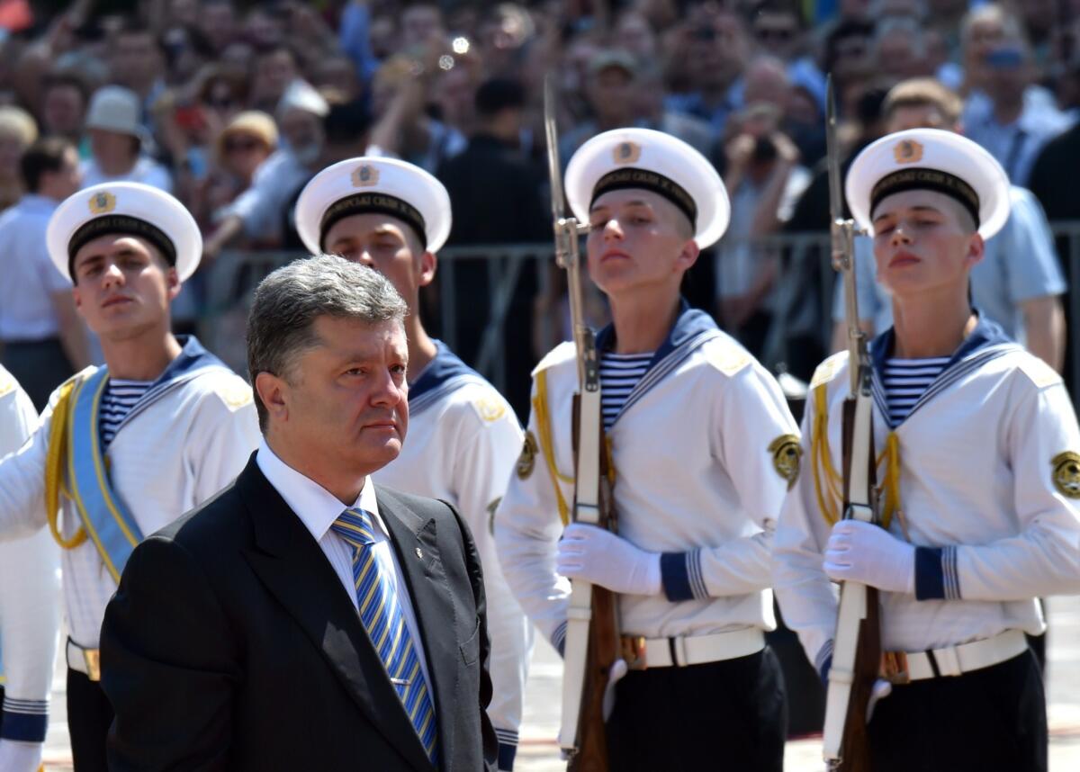 Ukraine's new president, Petro Poroshenko, passes an honor guard at his inauguration in Kiev.