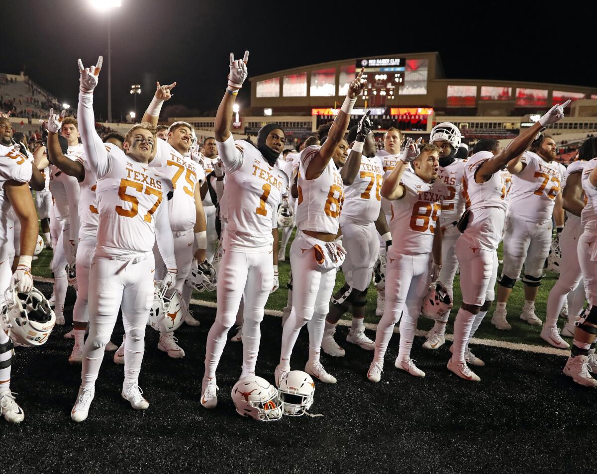 University of Texas football players sing "The Eyes of Texas" after a game against Texas Tech on Nov. 10, 2018.