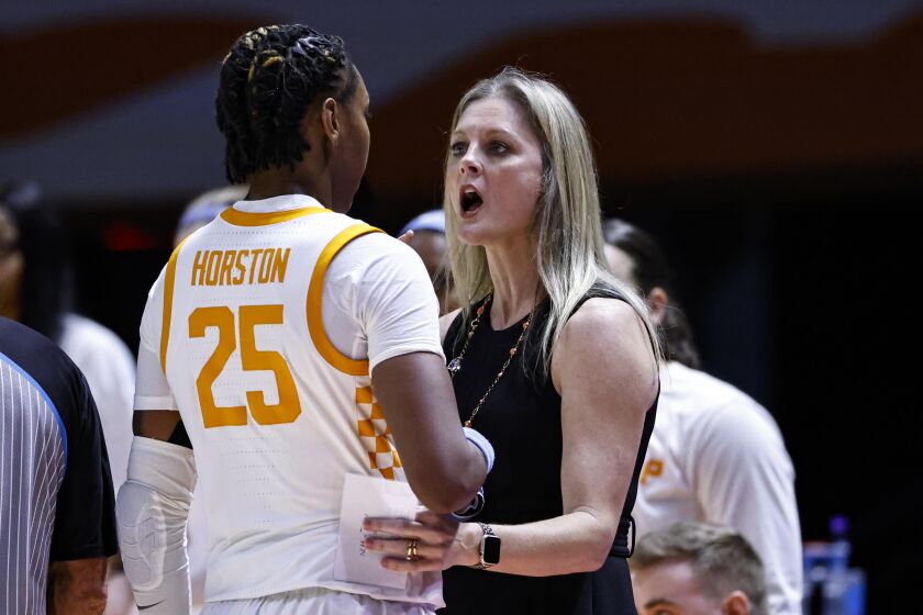 Tennessee head coach Kellie Harper, right, talks to guard Jordan Horston (25) in the first half of a second-round college basketball game against Toledo in the NCAA Tournament, Monday, March 20, 2023, in Knoxville, Tenn. (AP Photo/Wade Payne)