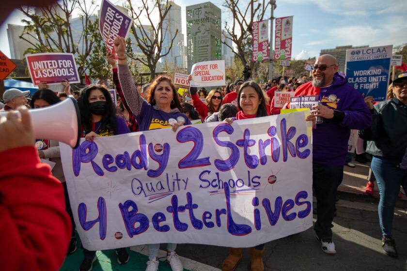 Los Angeles, CA - March 15: A crowd gathered in Grand Park infant of City Hall on Wednesday, March 15, 2023, in Los Angeles, CA. United Teachers of Los Angeles and SEIU 99 members hold a joint rally at Grand Park in a historic show of solidarity. It has been almost ten months since the contract between LAUSD and UTLA has expired, and a staggering three years for SEIU members, leaving almost 60,000 employees vulnerable in the midst of a record-high inflation and a housing crisis. (Francine Orr / Los Angeles Times)