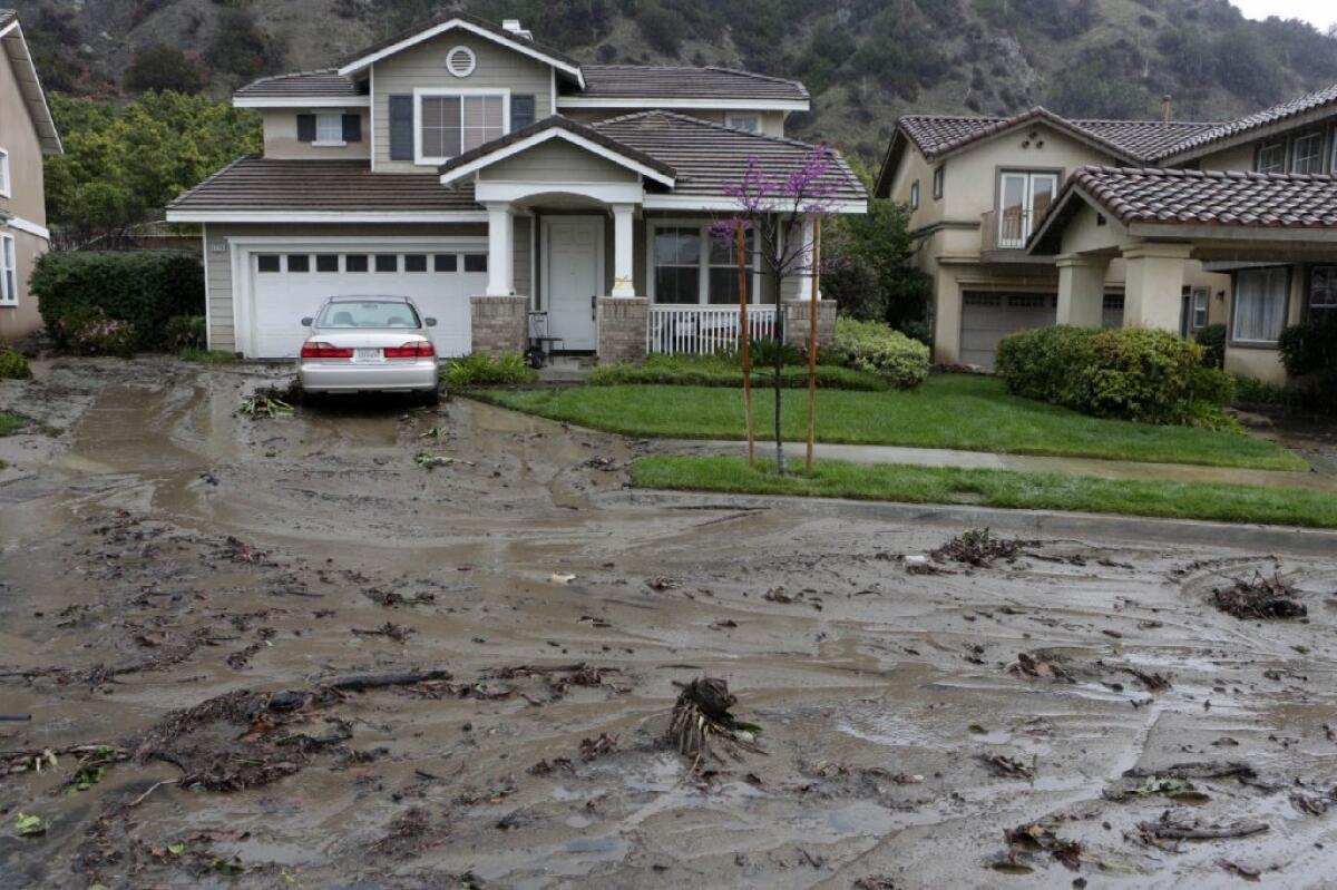 A river of mud makes its way down Ridge View Drive in Azusa on Saturday morning.