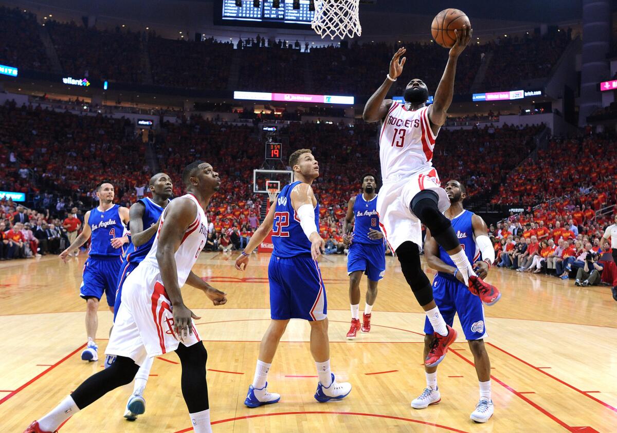 Rockets guard James Harden beats the Clippers defense for a layup during Game 7 of their second-round playoff series in Houston on May 17.