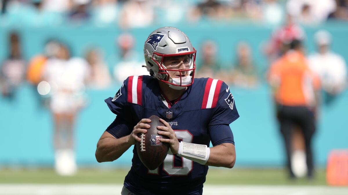 New England Patriots quarterback Mac Jones drops back to pass.